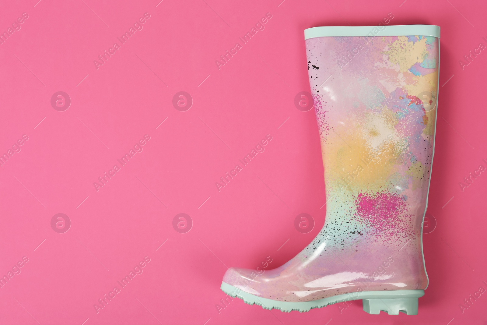 Photo of Gumboot on color background, top view. Female shoes