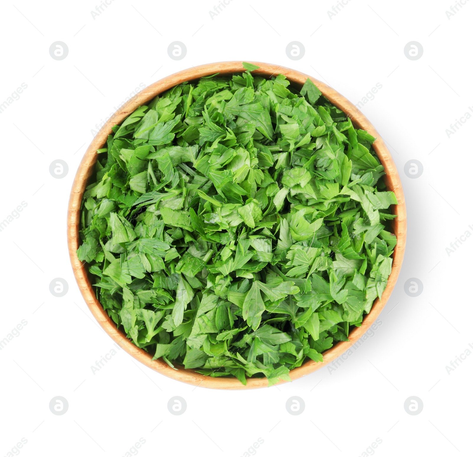 Chopped parsley leaves in wooden bowl isolated on white, top view Photo of Chopped parsley leaves in wooden bowl isolated on white, top view