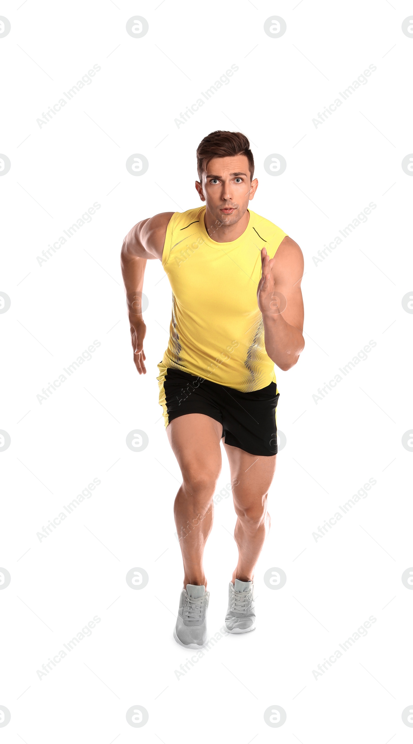 Photo of Sporty young man running on white background