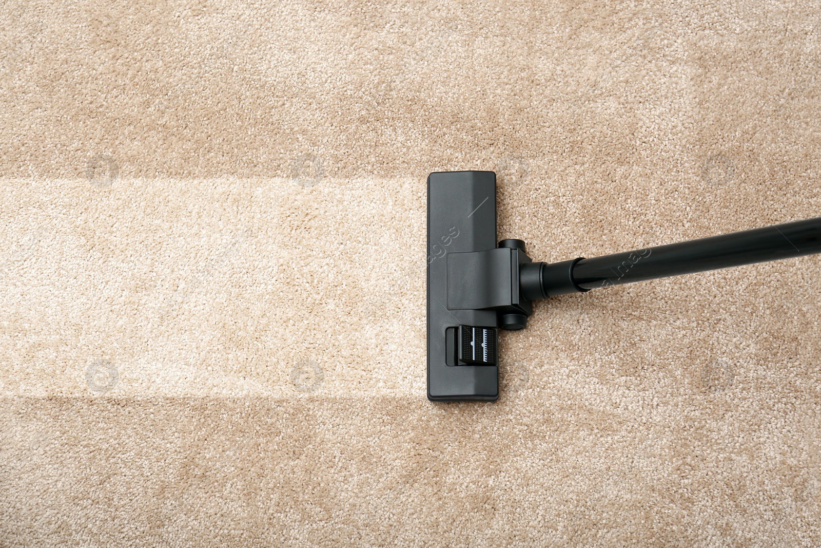 Image of Vacuuming carpet. Clean area after using device