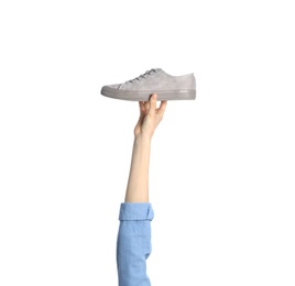 Photo of Woman holding sportive shoe on white background, closeup