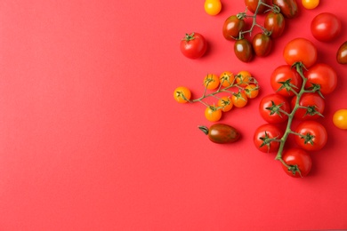 Photo of Flat lay composition with fresh ripe tomatoes on red background. Space for text