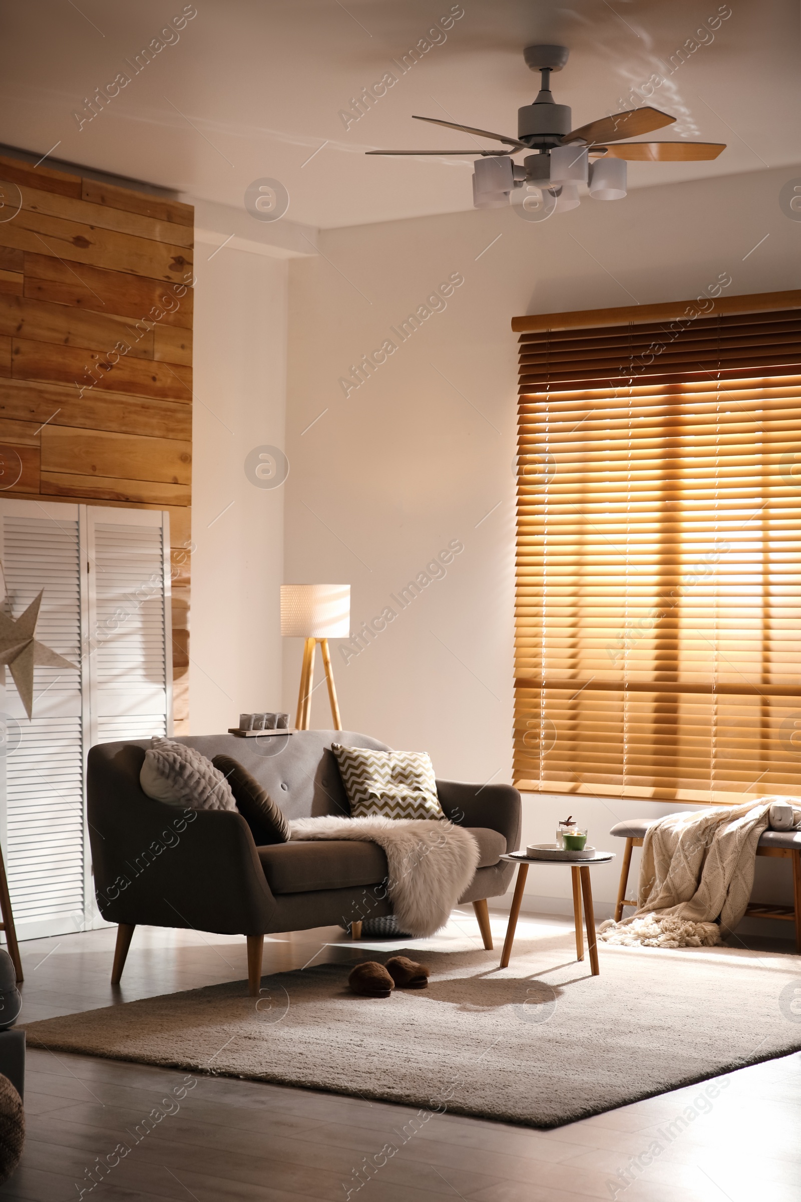 Photo of Spacious living room interior with comfortable sofa