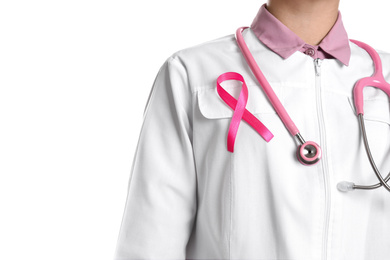 Photo of Doctor with pink ribbon and stethoscope on white background, closeup. Breast cancer awareness