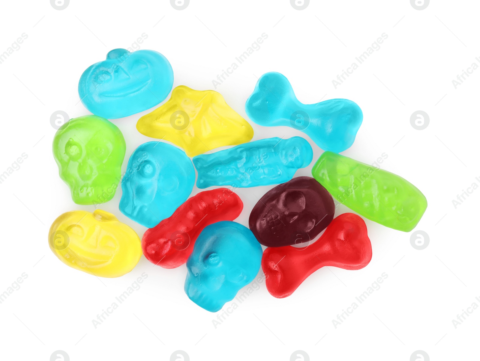 Photo of Delicious colorful candies on white background, top view. Halloween sweets