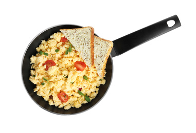 Tasty scrambled eggs with sprouts, cherry tomato and bread in frying pan isolated on white, top view