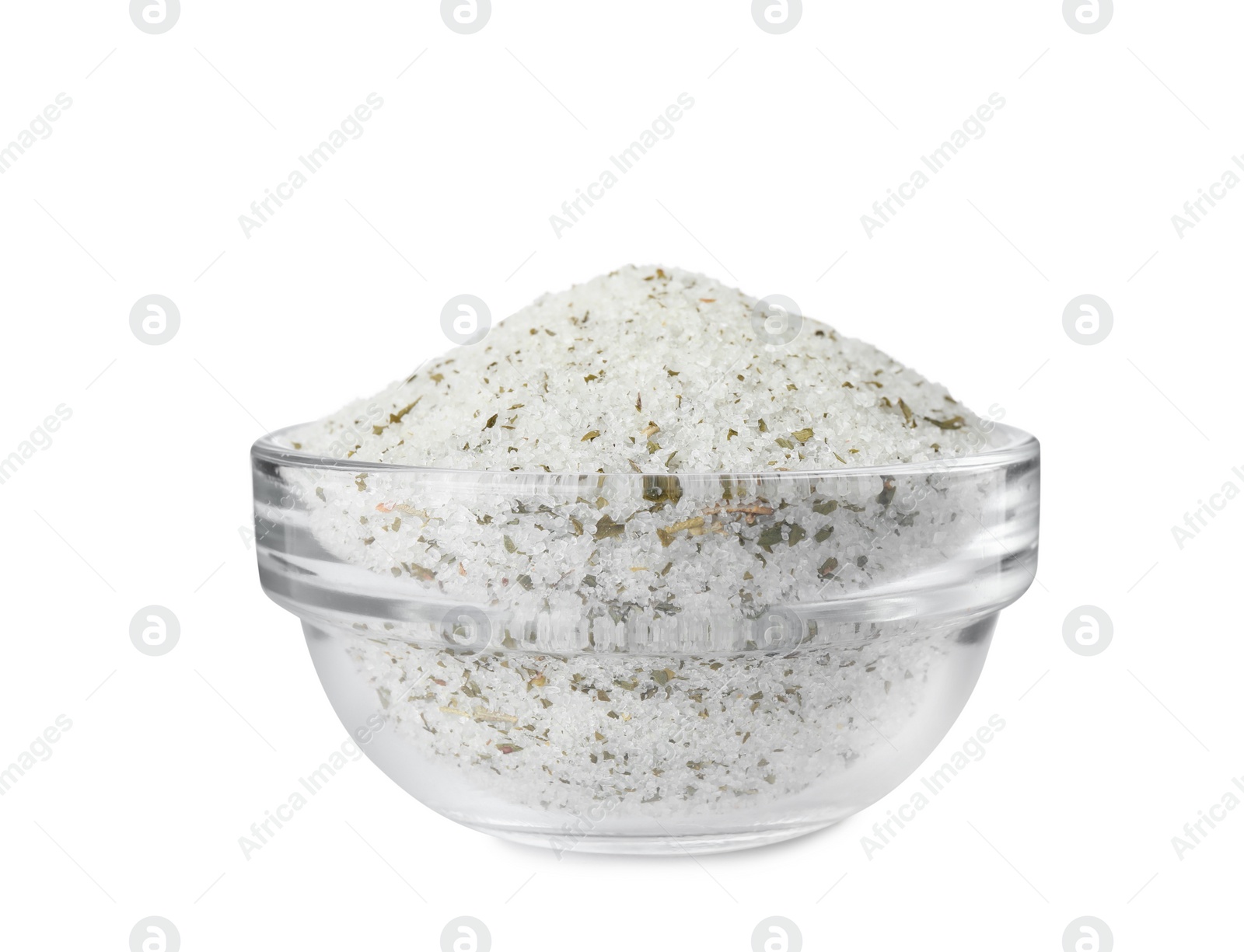 Photo of Natural herb salt in glass bowl isolated on white