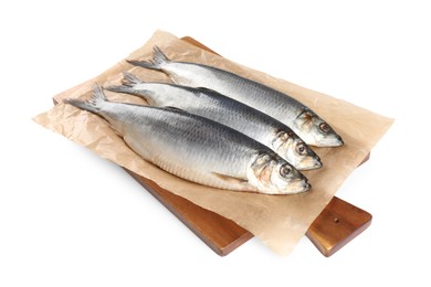 Photo of Wooden board with salted herrings isolated on white