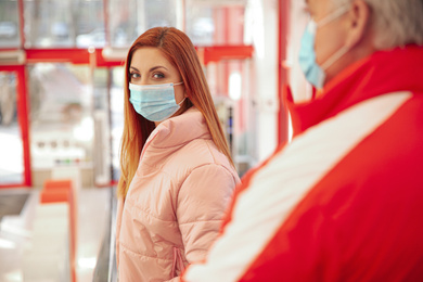 Woman with medical mask indoors. Virus protection