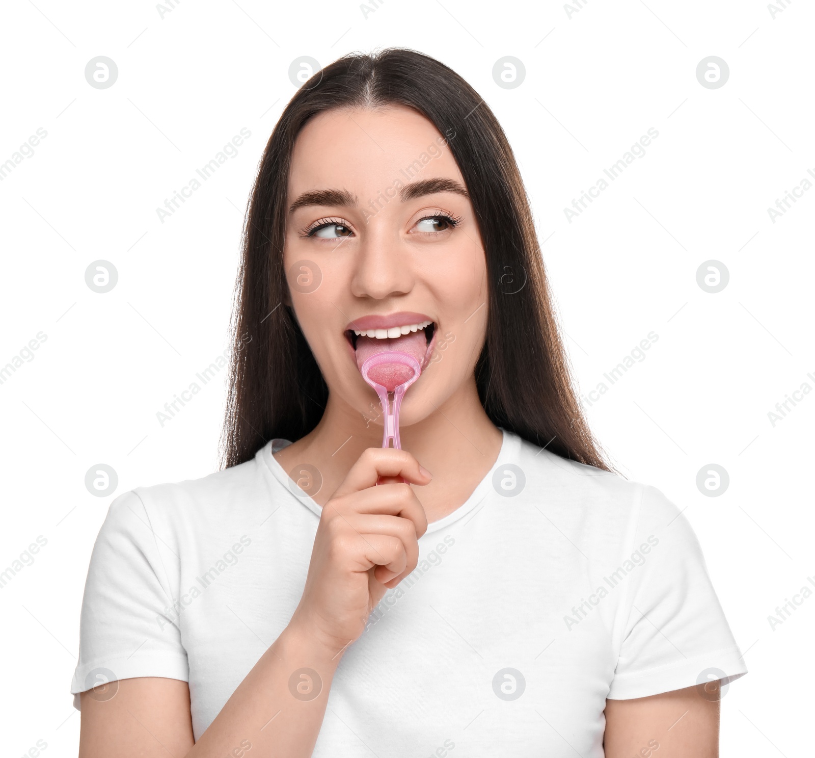 Photo of Happy woman brushing her tongue with cleaner on white background