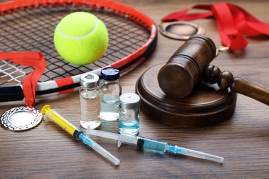 Photo of Composition with drugs on wooden table. Doping control