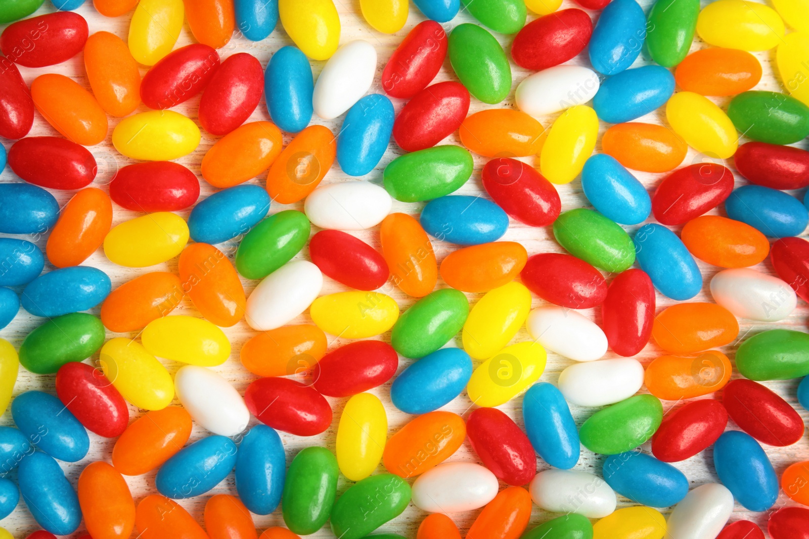 Photo of Delicious jelly beans of different colors, closeup