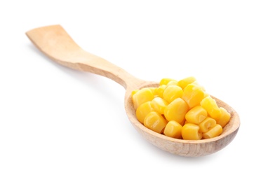 Wooden spoon with corn kernels on white background