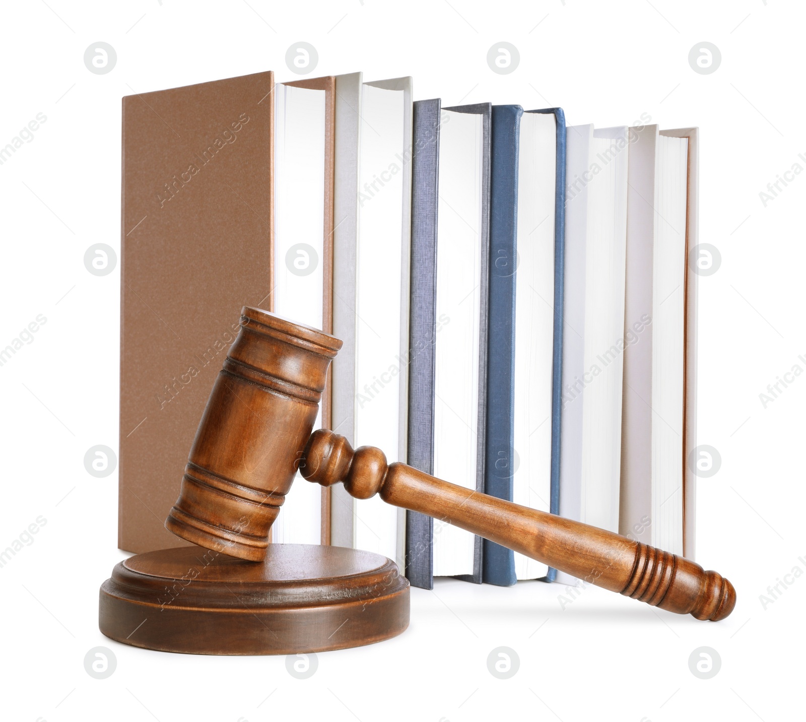 Photo of Wooden gavel and books on white background