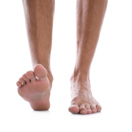 Photo of Man standing on white background, closeup of feet