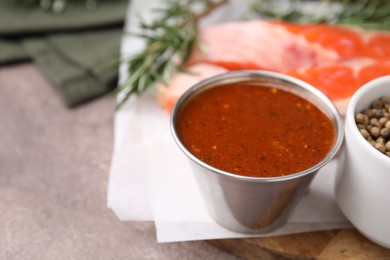 Photo of Tasty fish marinade in bowl on table, closeup. Space for text