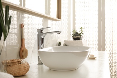 Photo of Stylish white sink in modern bathroom interior