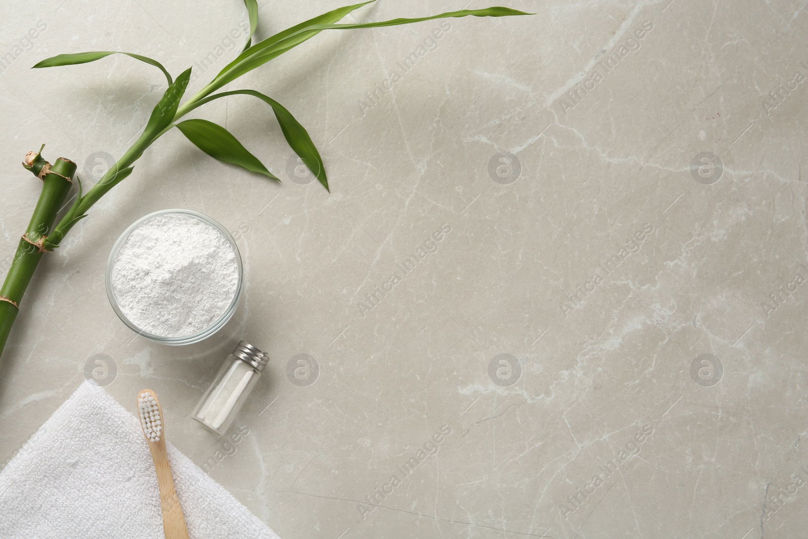 Photo of Flat lay composition with tooth powder and bamboo stem on light grey marble table, space for text