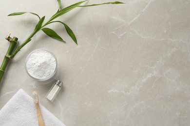 Photo of Flat lay composition with tooth powder and bamboo stem on light grey marble table, space for text