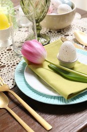 Photo of Festive table setting with beautiful tulip, closeup. Easter celebration