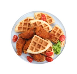 Plate with tasty Belgian waffles, fried chicken, tomatoes and lettuce isolated on white, top view