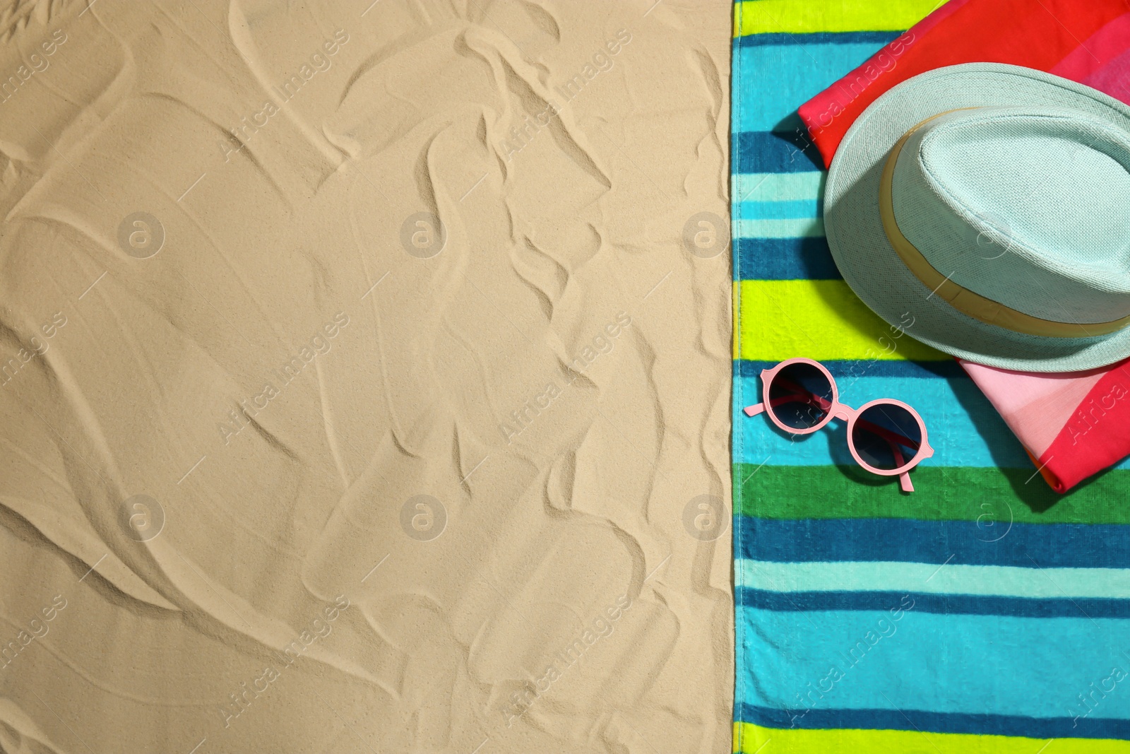 Photo of Flat lay composition with beach objects and space for text on sand