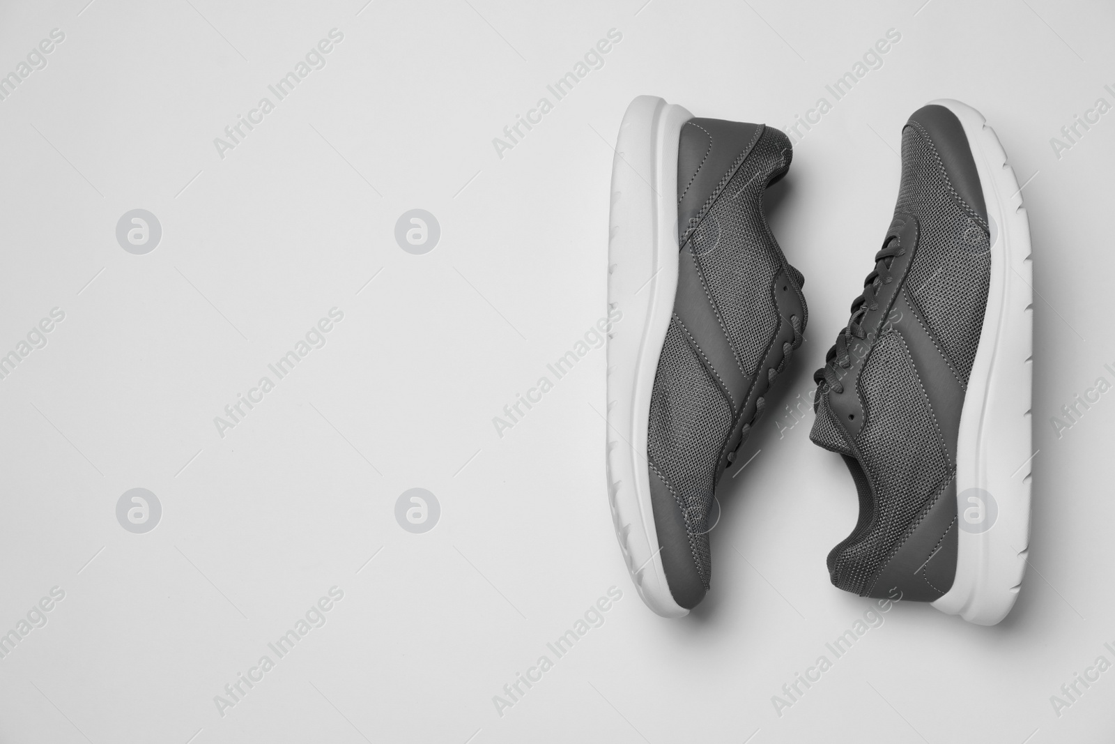 Photo of Pair of stylish sport shoes on white background, flat lay. Space for text