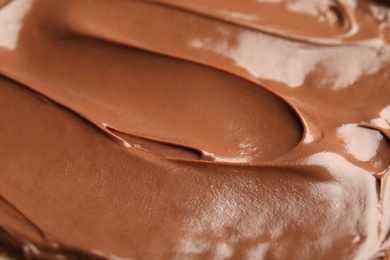 Photo of Sweet tasty chocolate cream as background, closeup