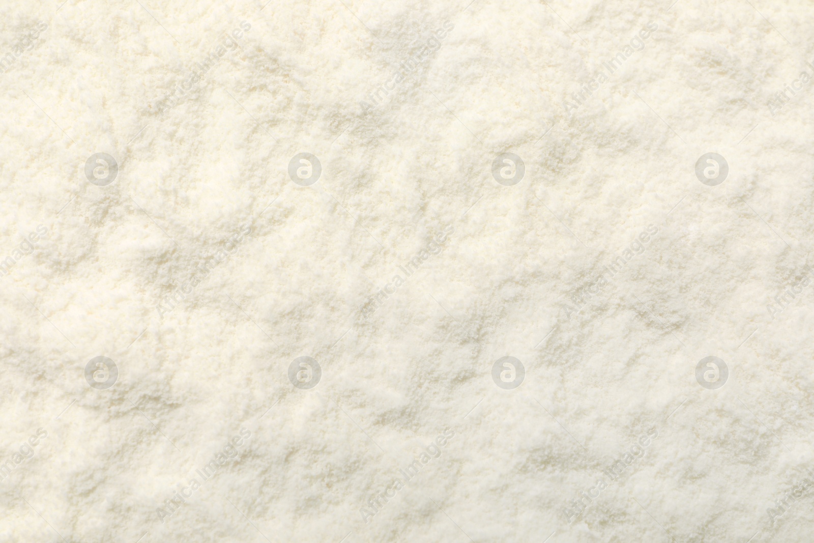 Photo of Closeup view of powdered infant formula as background. Baby milk