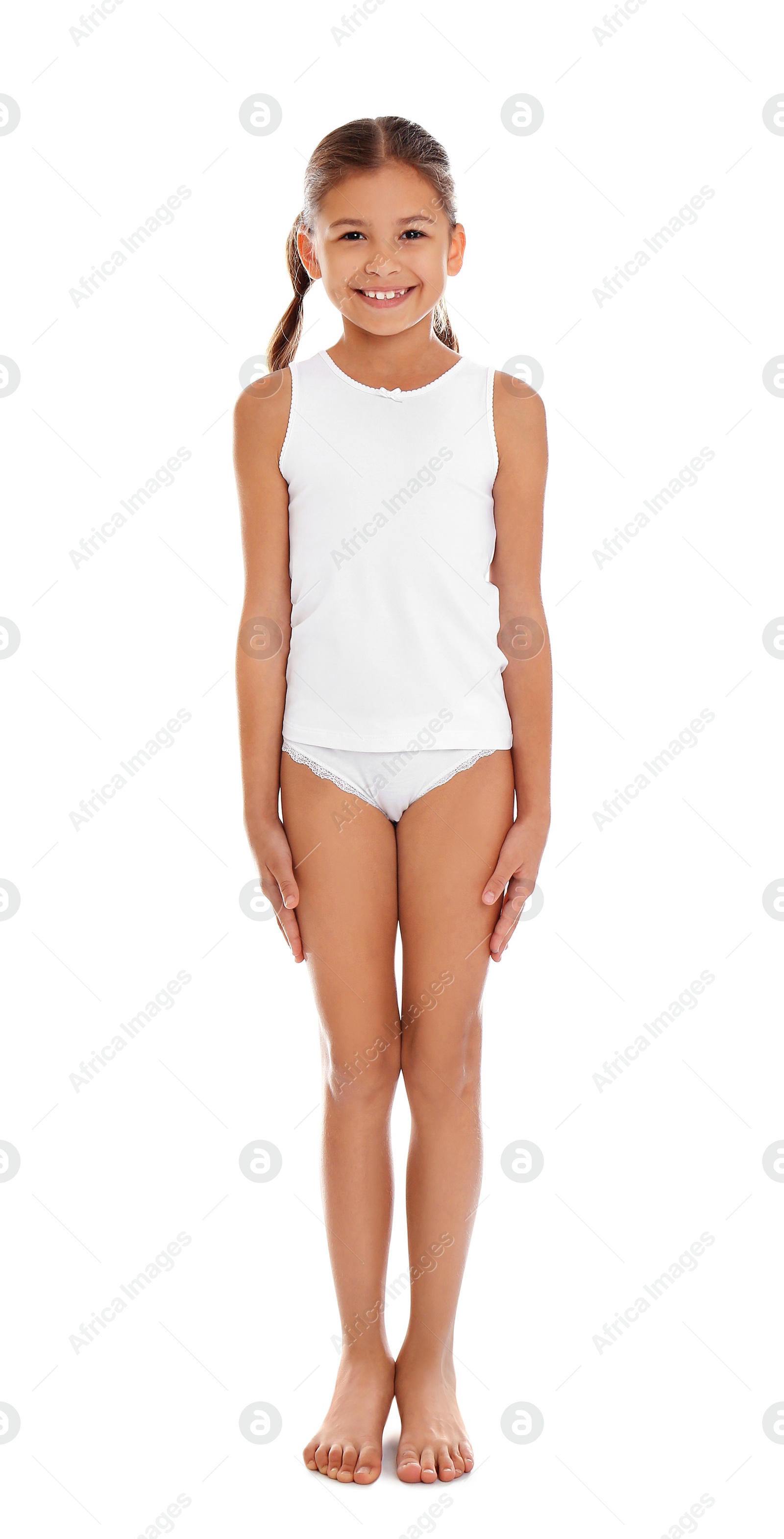 Photo of Cute little girl in underwear on white background