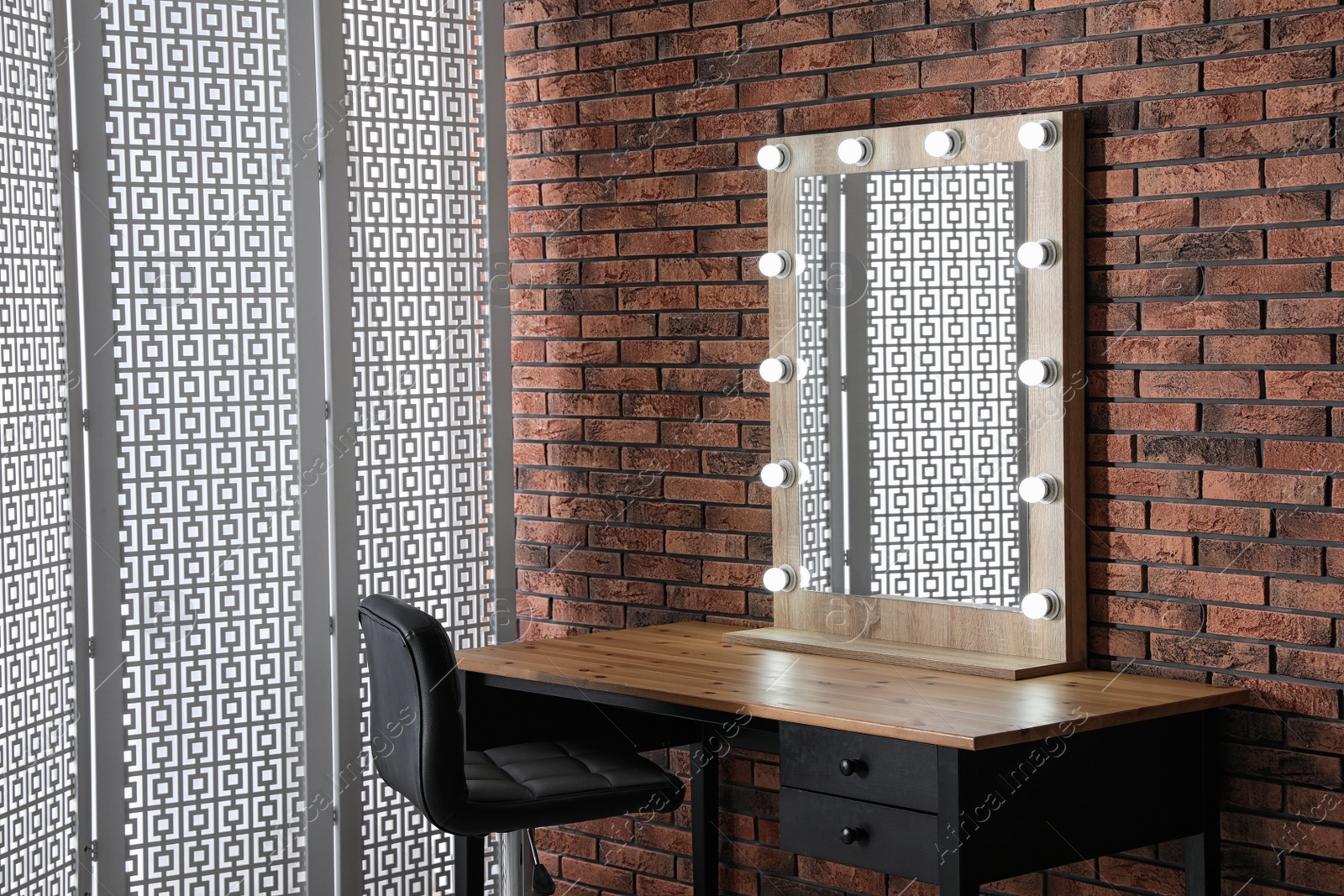 Photo of Makeup room interior with wooden table and large mirror