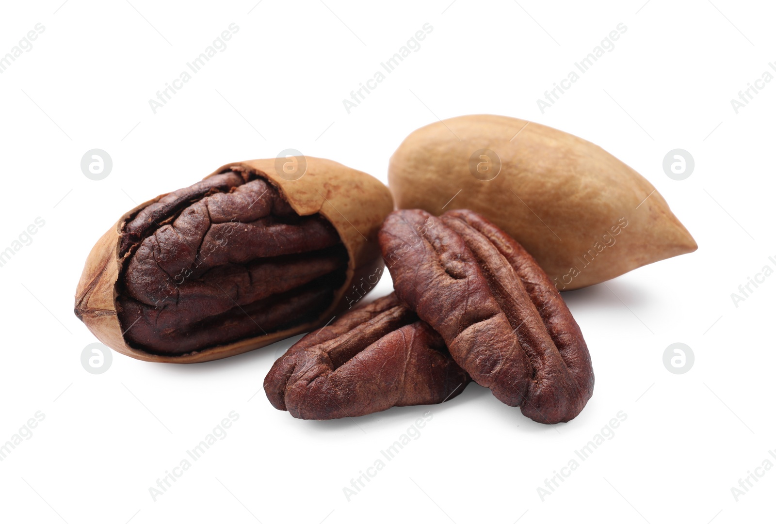 Photo of Many tasty pecan nuts isolated on white