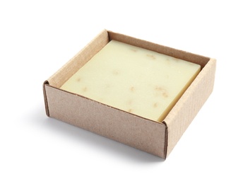 Hand made soap bar in cardboard package on white background