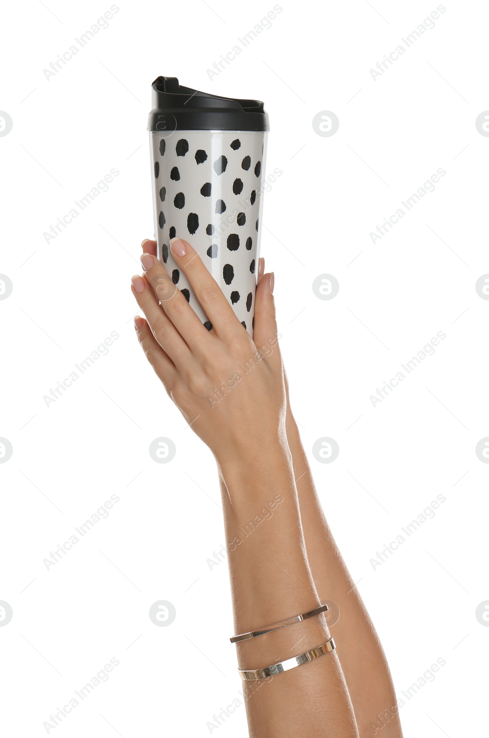 Photo of Woman holding elegant thermocup on white background, closeup