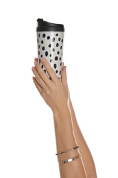 Woman holding elegant thermocup on white background, closeup