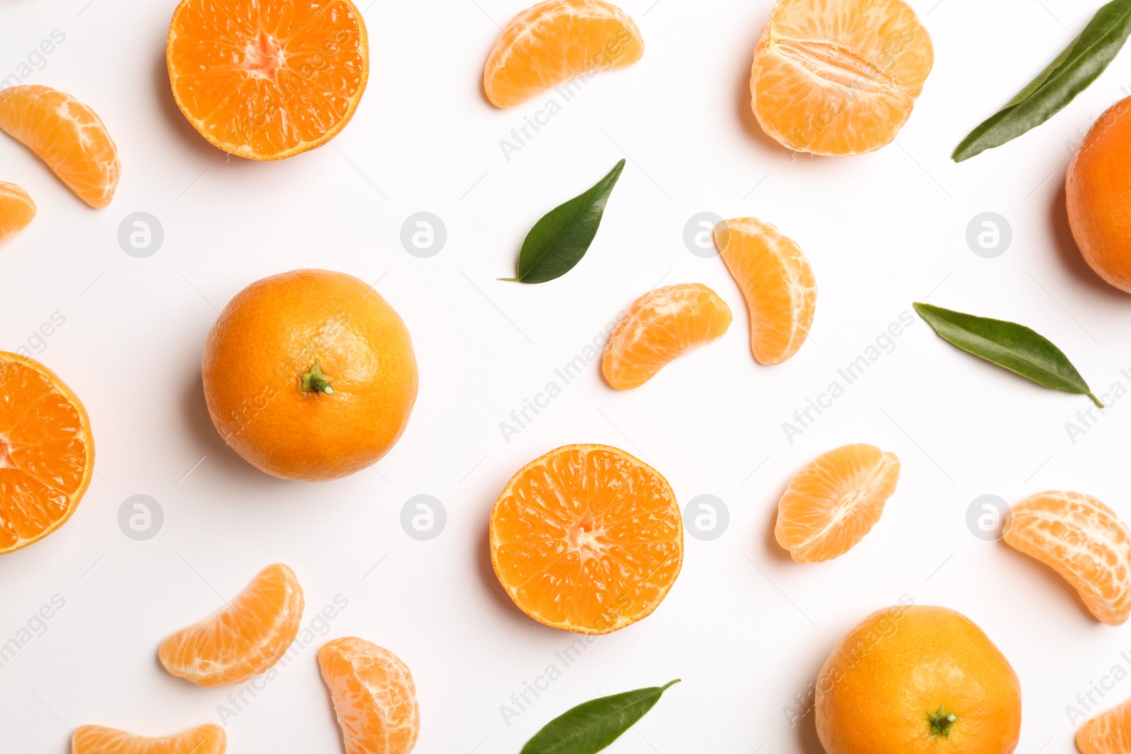 Photo of Composition with tangerines and leaves on white background, top view