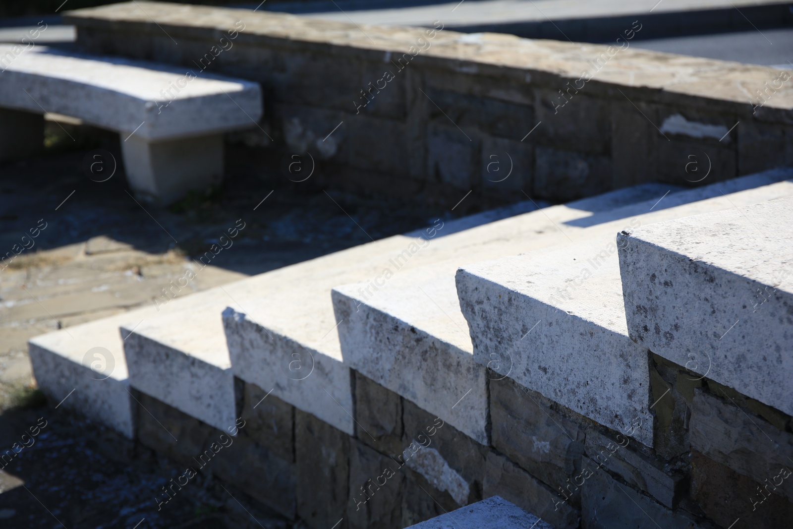 Photo of View of empty old concrete staircase outdoors on sunny day