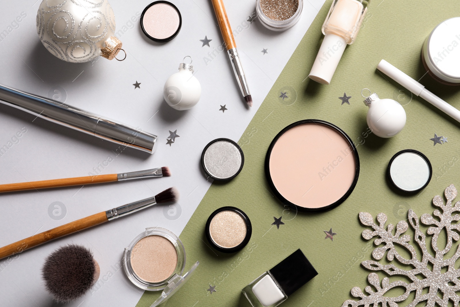 Photo of Flat lay composition with makeup products and Christmas decor on color background