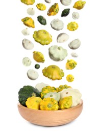 Image of Fresh ripe pattypan squashes falling into bowl on white background 