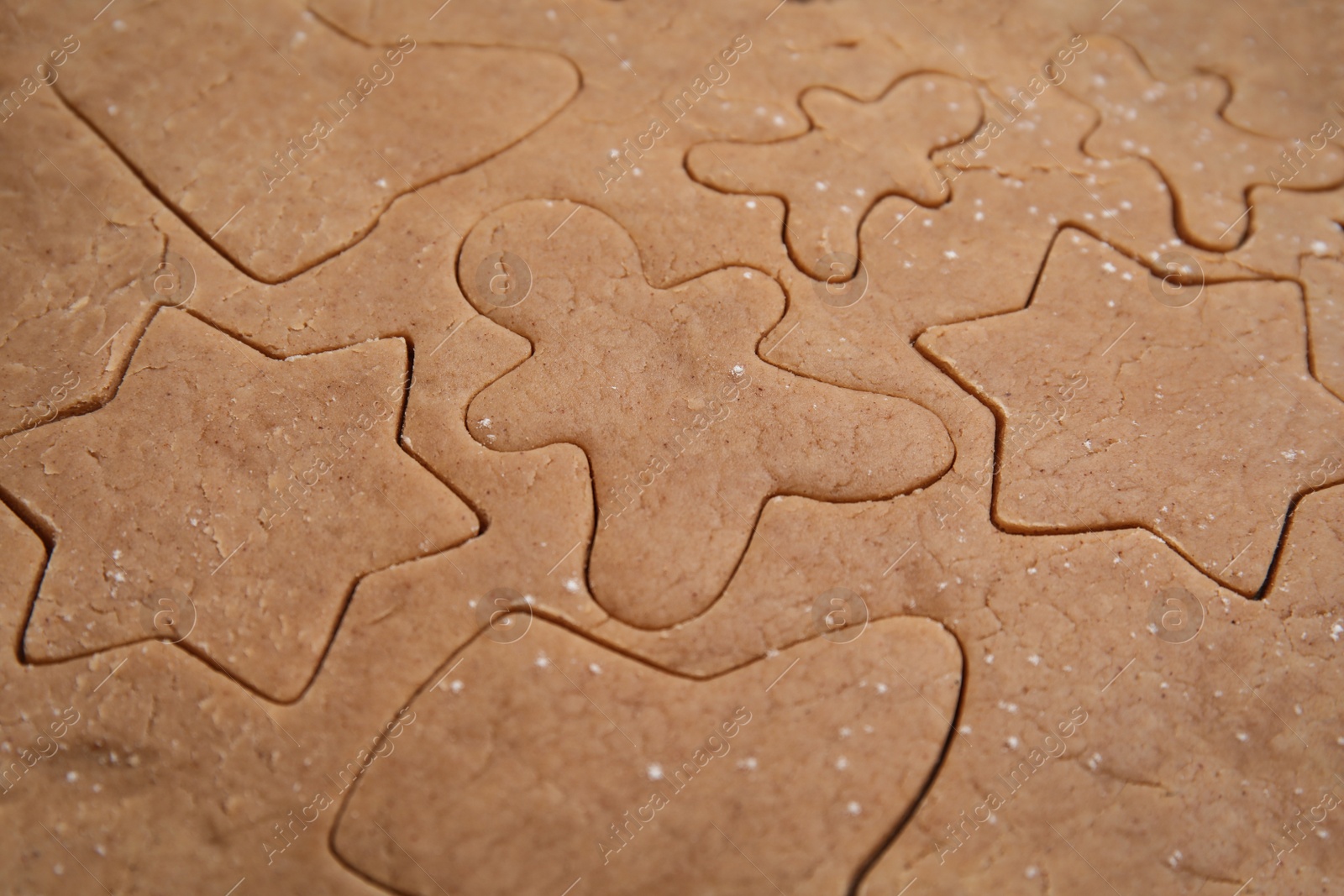 Photo of Making Christmas cookies. Raw dough as background, closeup