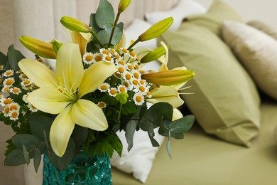 Photo of Bouquet of beautiful flowers in bedroom, closeup