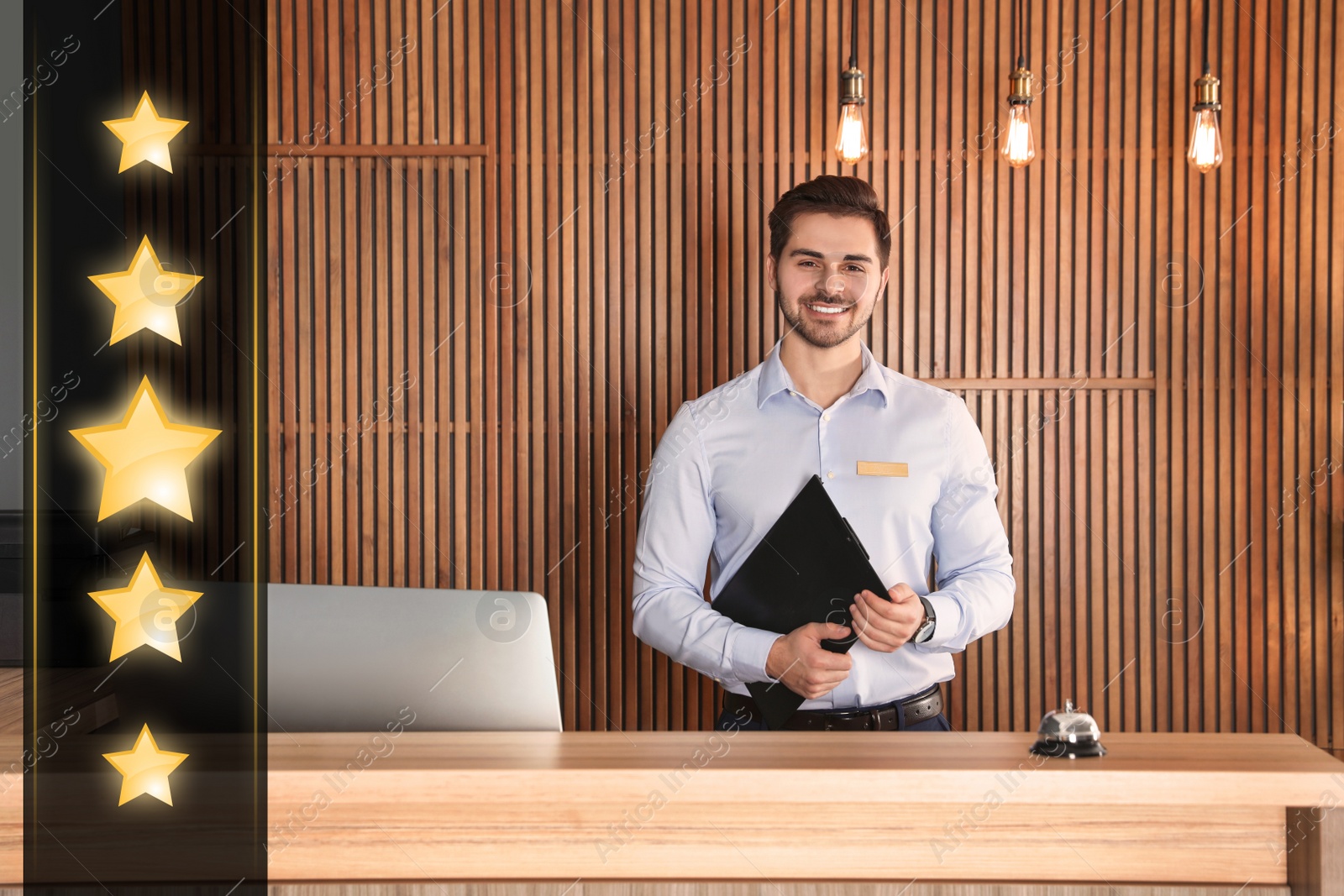 Image of Five Star Luxury Hotel. Portrait of receptionist at desk in lobby