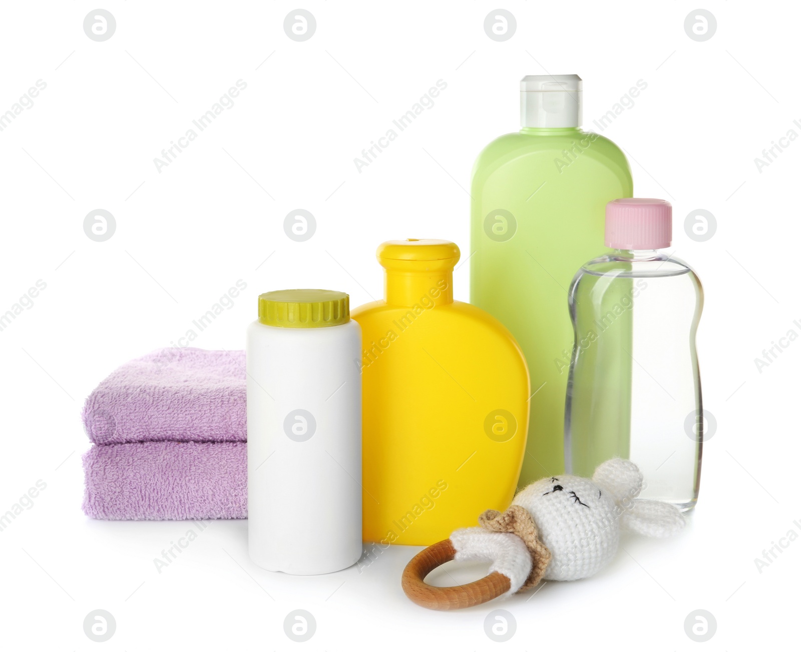 Photo of Set of baby cosmetic products, towels and toy on white background