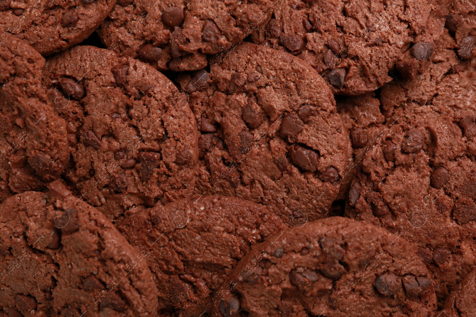 Photo of Tasty chocolate cookies as background, top view