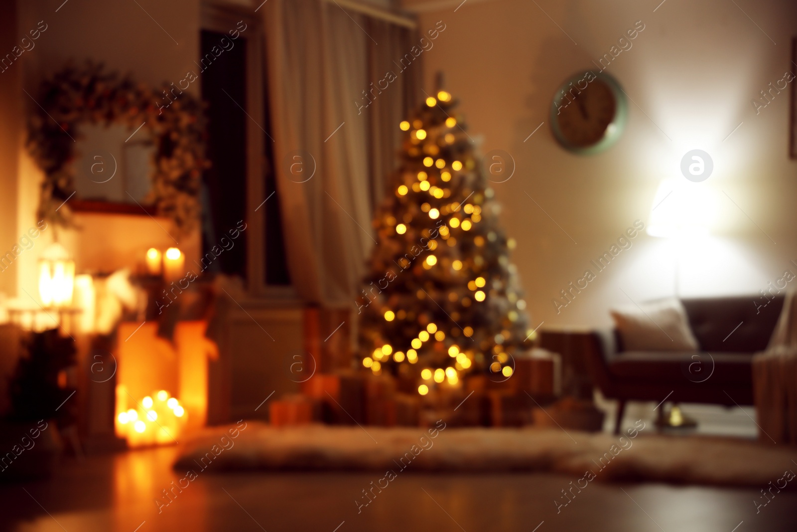 Photo of Blurred view of festive interior with Christmas tree and decorative fireplace