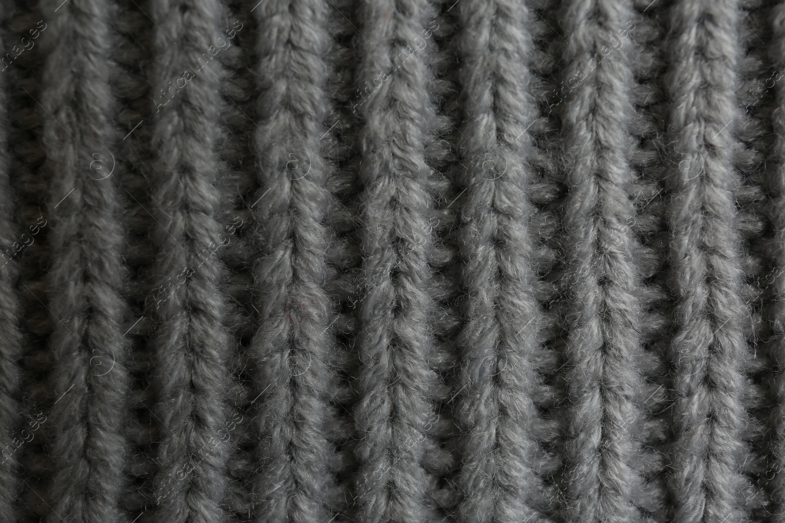 Photo of Beautiful grey knitted fabric as background, top view