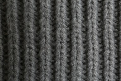 Photo of Beautiful grey knitted fabric as background, top view