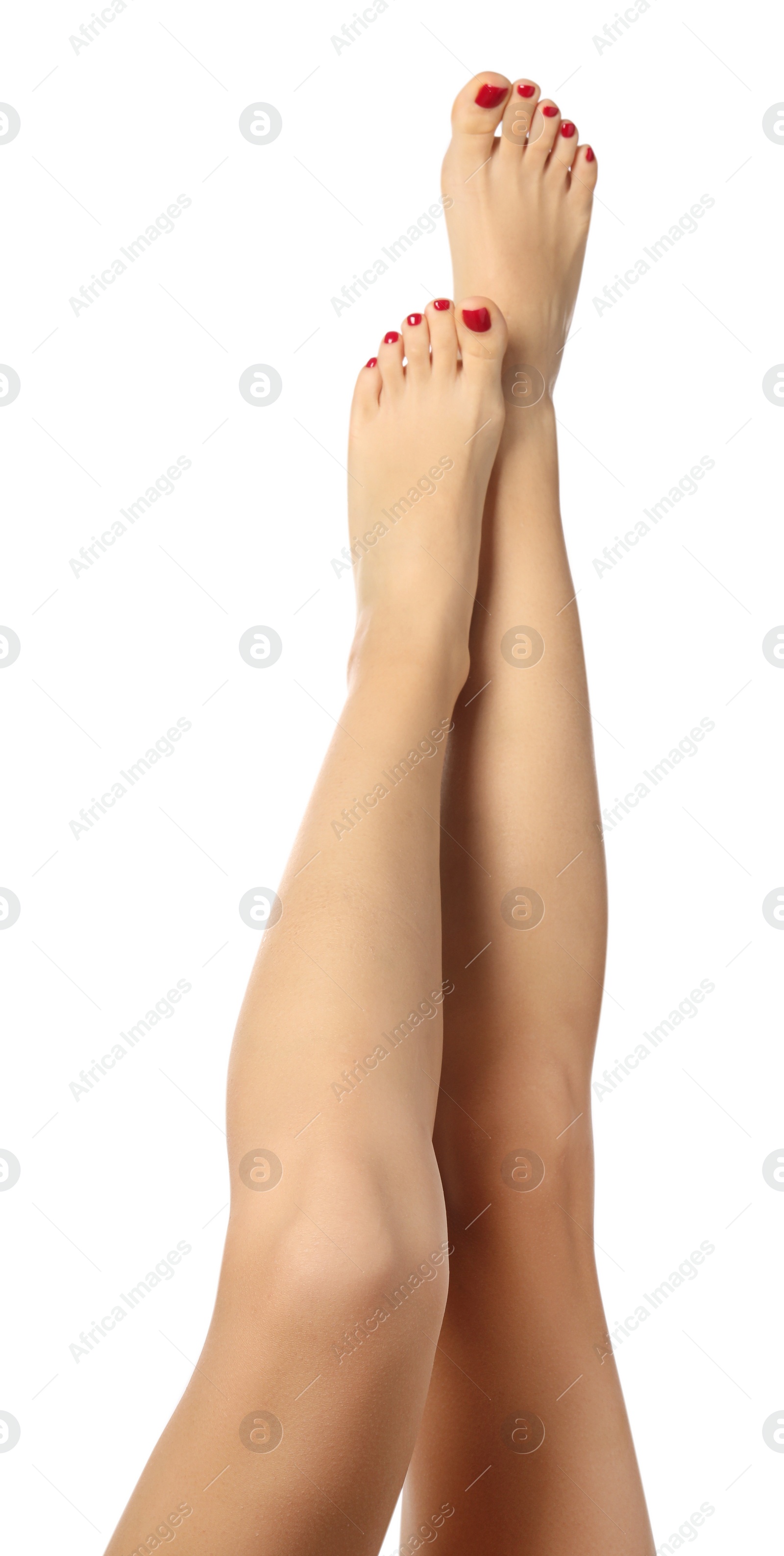 Photo of Woman with stylish red toenails after pedicure procedure isolated on white, closeup