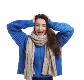 Young woman wearing warm clothes on white background. Winter season