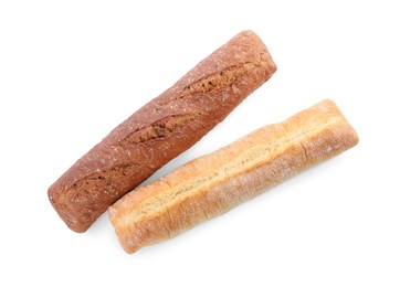 Photo of Different tasty baguettes on white background, top view. Fresh bread